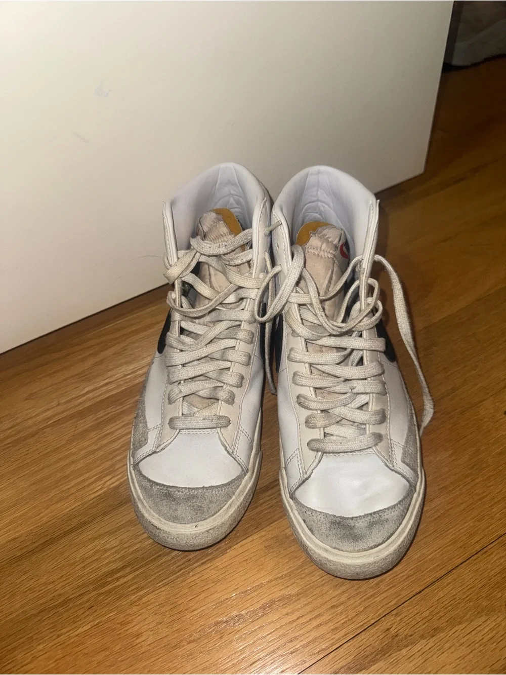 Nike White High-Top Sneakers with Black Swoosh